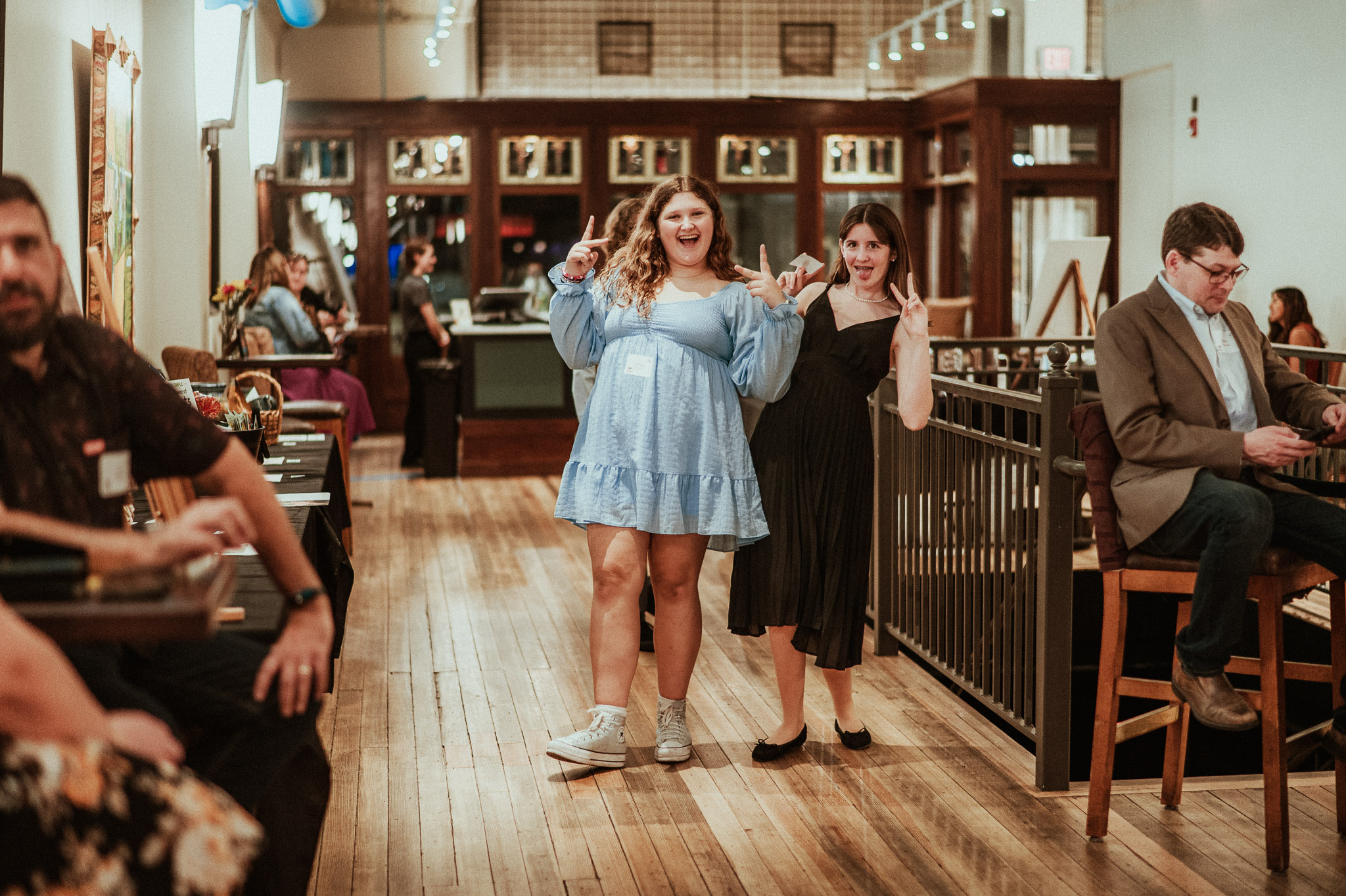 girls smiling at auction